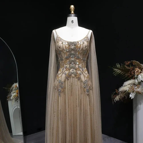 The Aurore — Champagne Beaded Glitter Sheer Cape Mermaid Gown