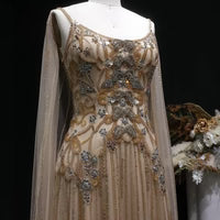 The Aurore — Champagne Beaded Glitter Sheer Cape Mermaid Gown