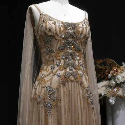 The Aurore — Champagne Beaded Glitter Sheer Cape Mermaid Gown