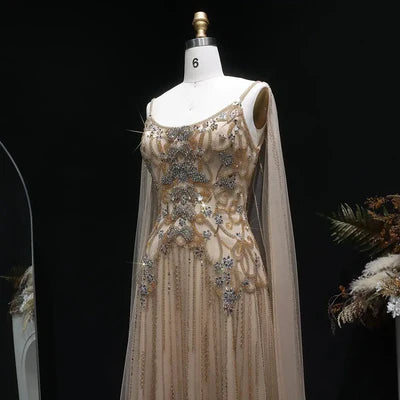 The Aurore — Champagne Beaded Glitter Sheer Cape Mermaid Gown