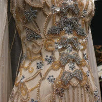 The Aurore — Champagne Beaded Glitter Sheer Cape Mermaid Gown