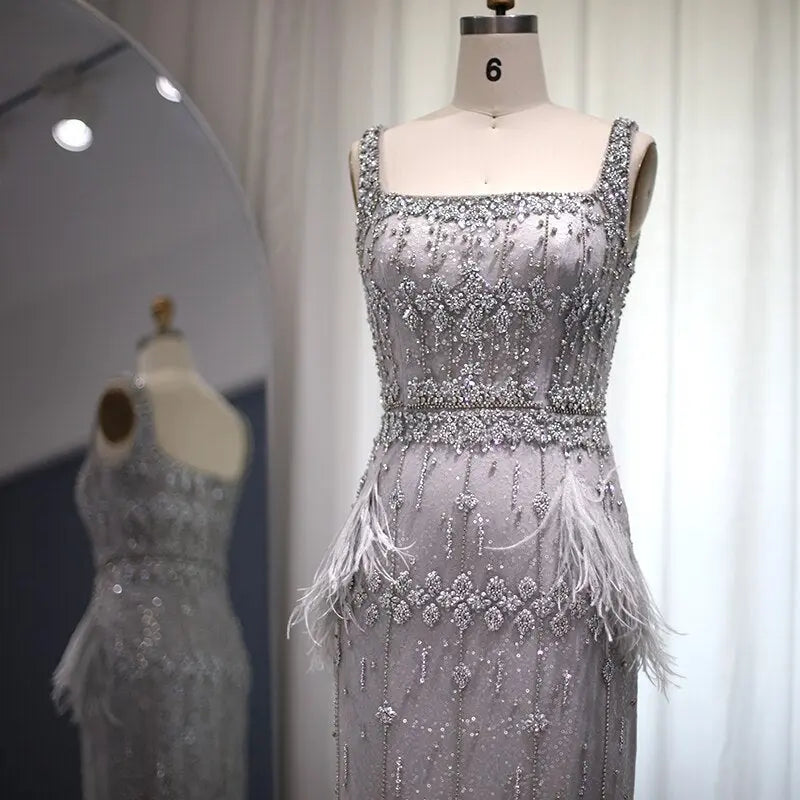 The Storm — Silver Feather Cape Mermaid Gown