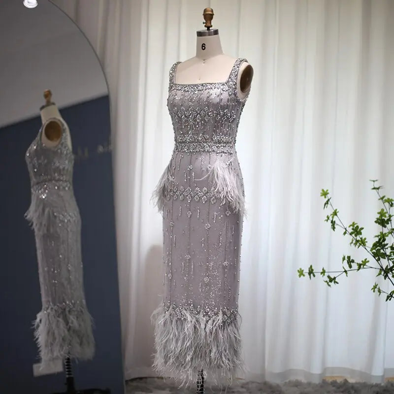 The Storm — Silver Feather Cape Mermaid Gown