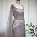 The Storm — Silver Feather Cape Mermaid Gown